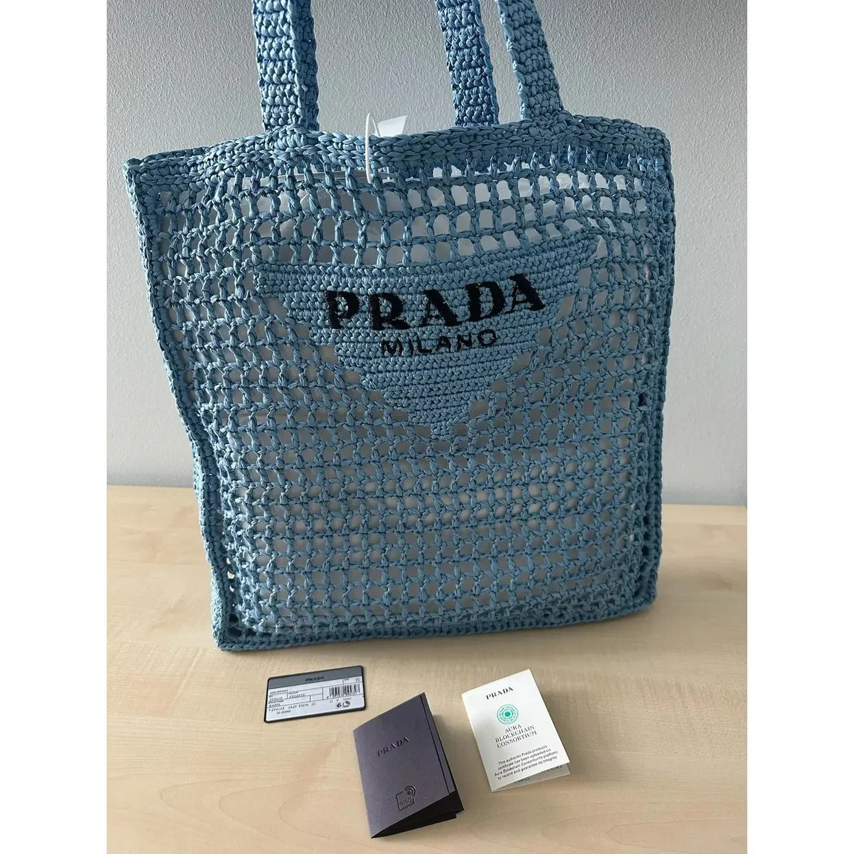 PRADA SHOPPER BAG IN RAFFIA WITH WOVEN LOGO – BLUE